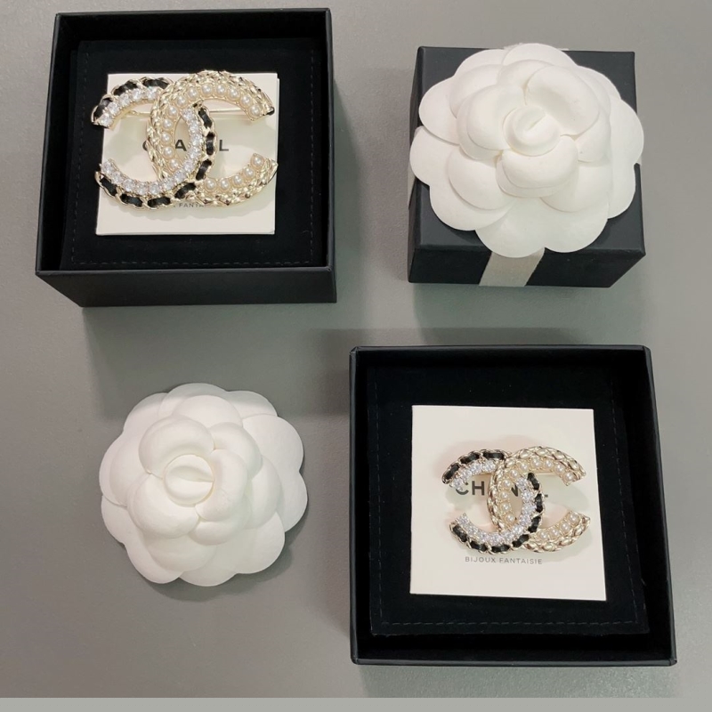 Ch*el brooches